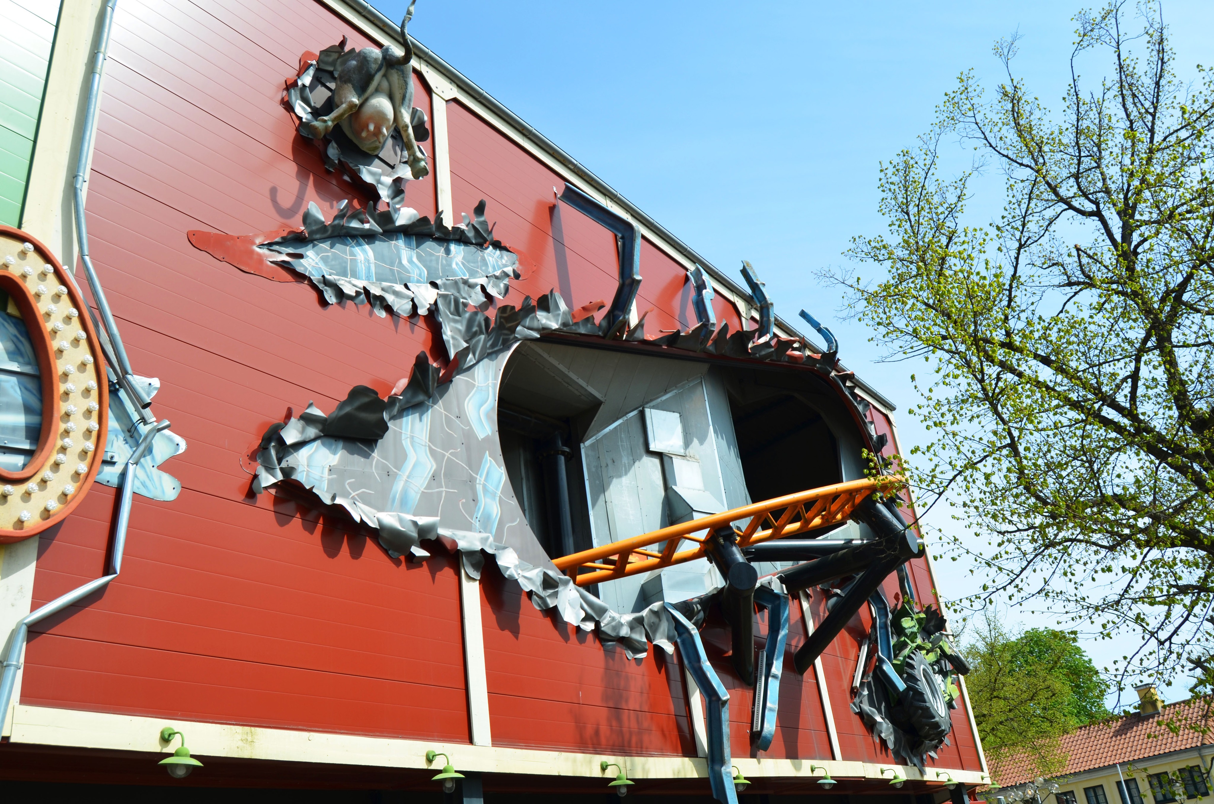 One of the rollercoasters at Bakken sticking out of the building